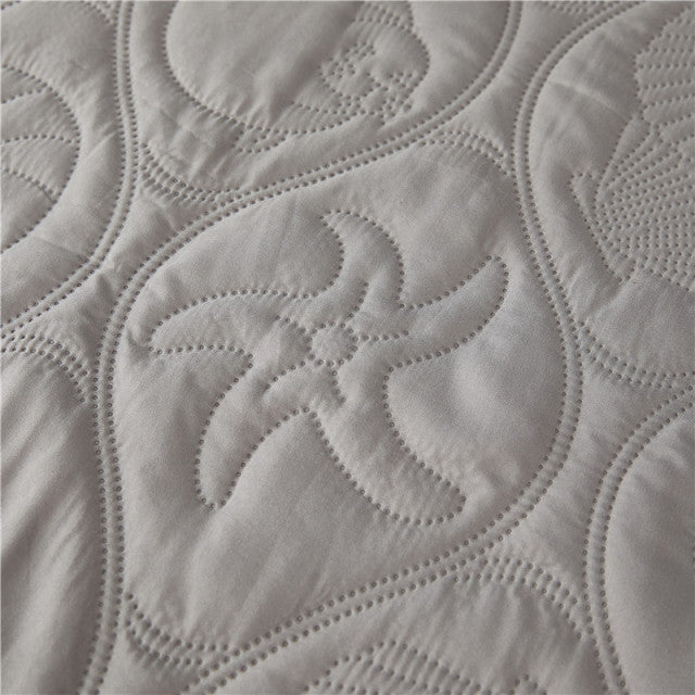 Solid color quilted embossed waterproof mattress protector.