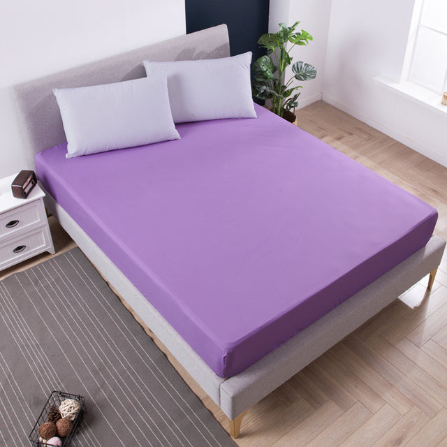 Solid color waterproof bed mattress protector with elastic band.